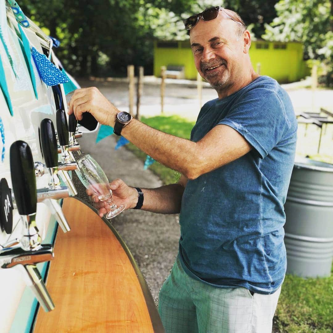 Man pouring a drink from the Kombi Keg mobile bar