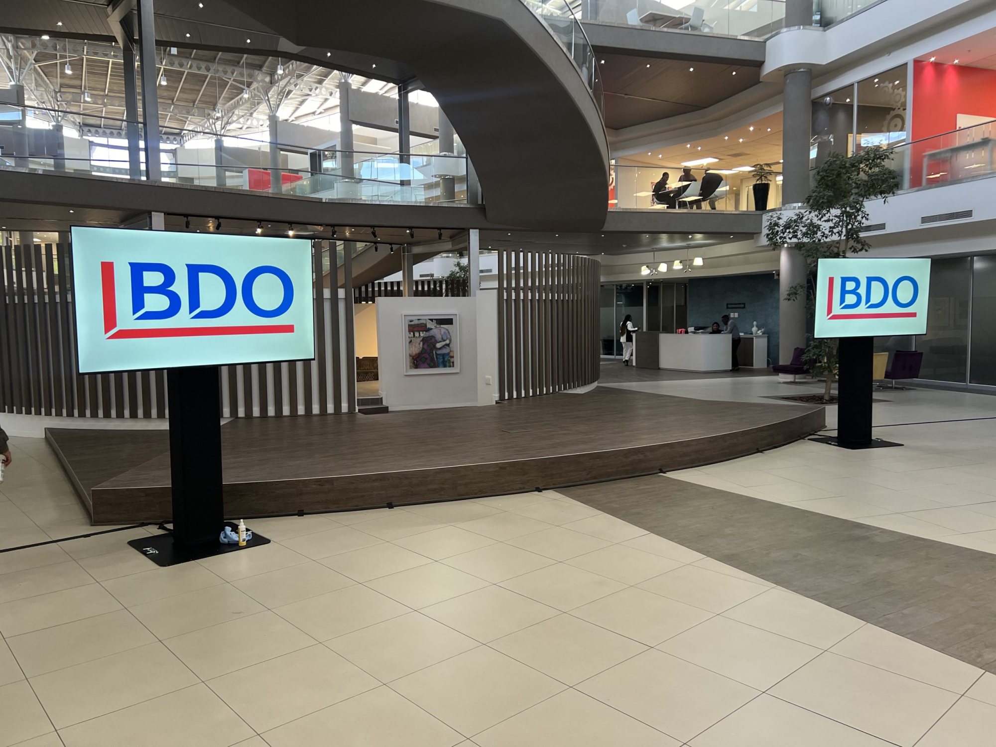 Two LED displays set up in a corporate venue