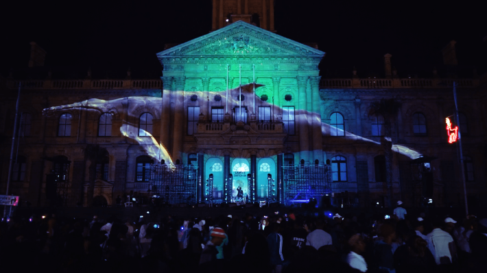 Projection mapping on a historic building with audience watching