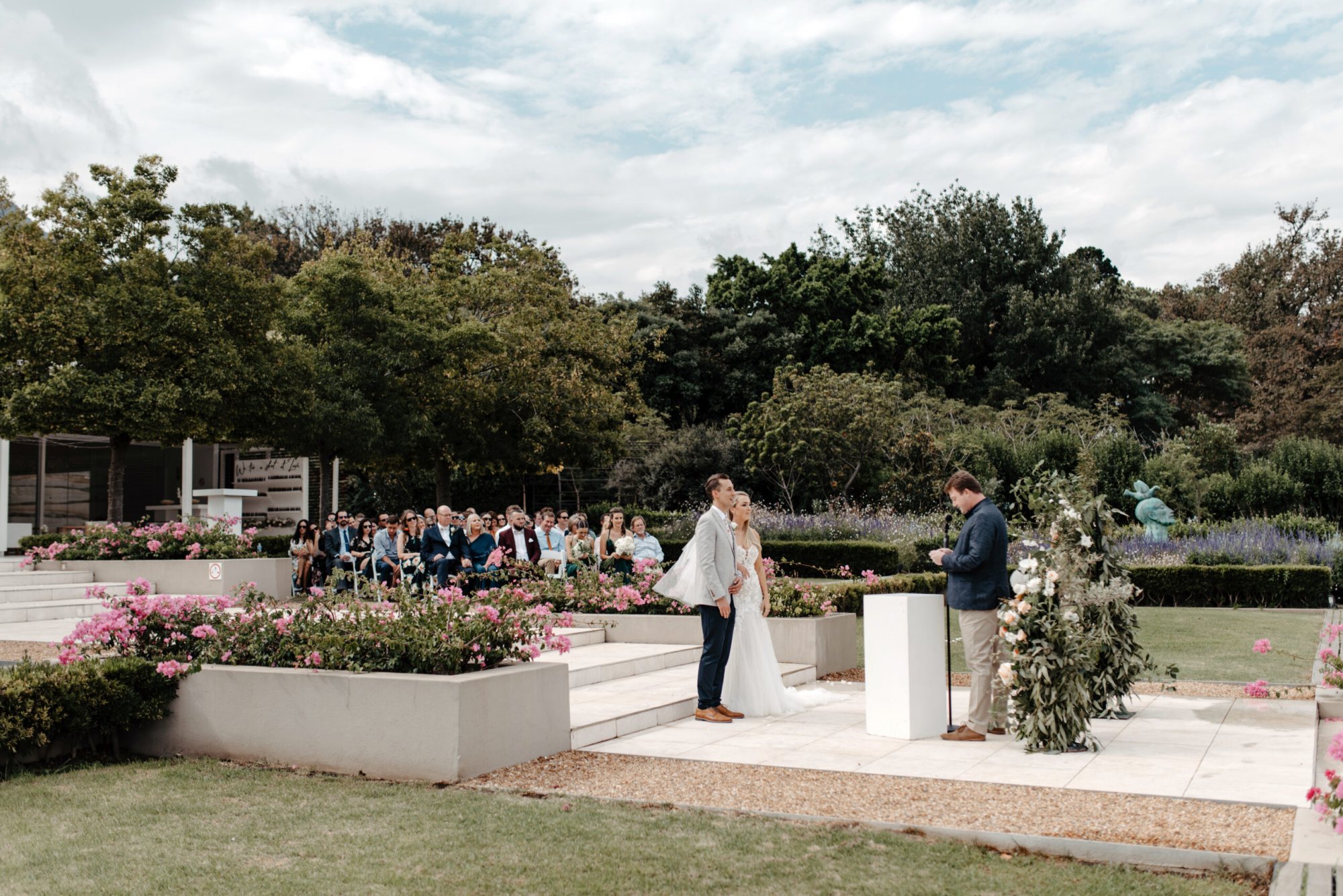 Couple exchanging vows during an outdoor wedding ceremony