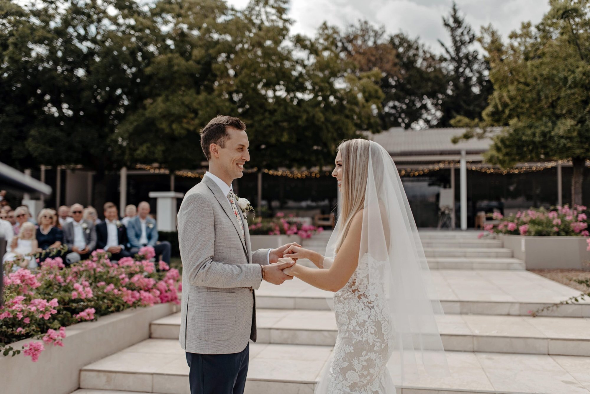 Couple exchanging vows during an outdoor wedding ceremony