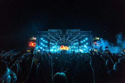 LED screen setup at a night event with audience