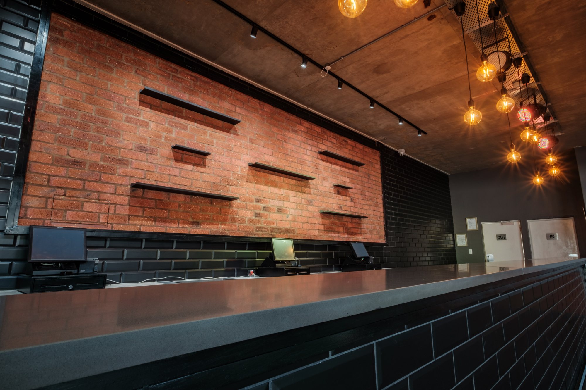 Reception area with brick wall and lighting features