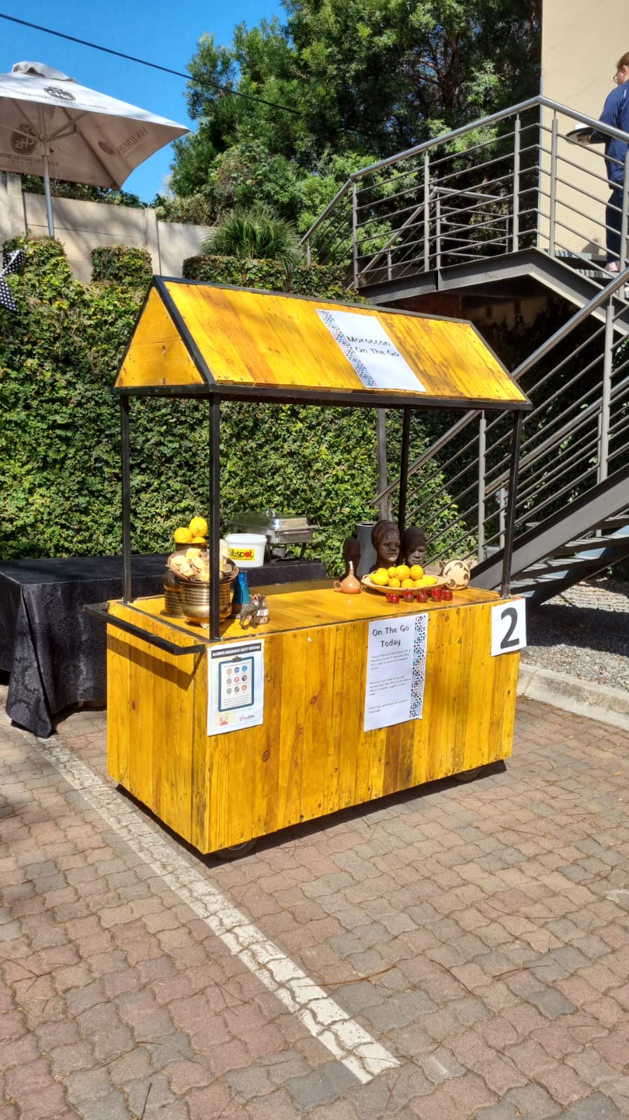 Wooden vintage ice cream cart with toppings and menus
