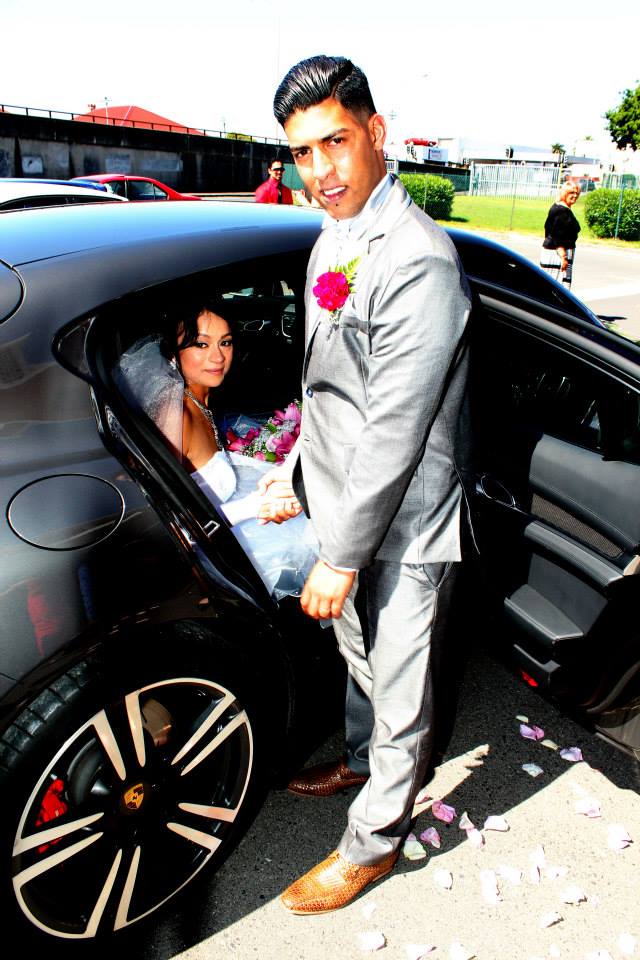 Bride arriving at wedding venue in luxury car