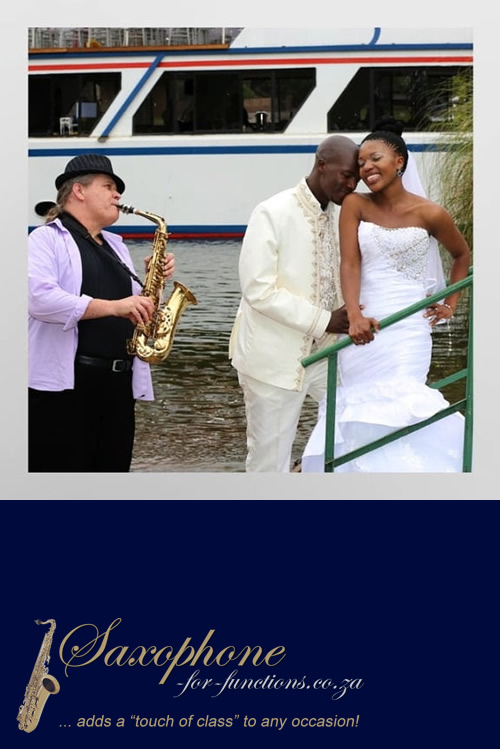 Saxophonist playing at a wedding by the water