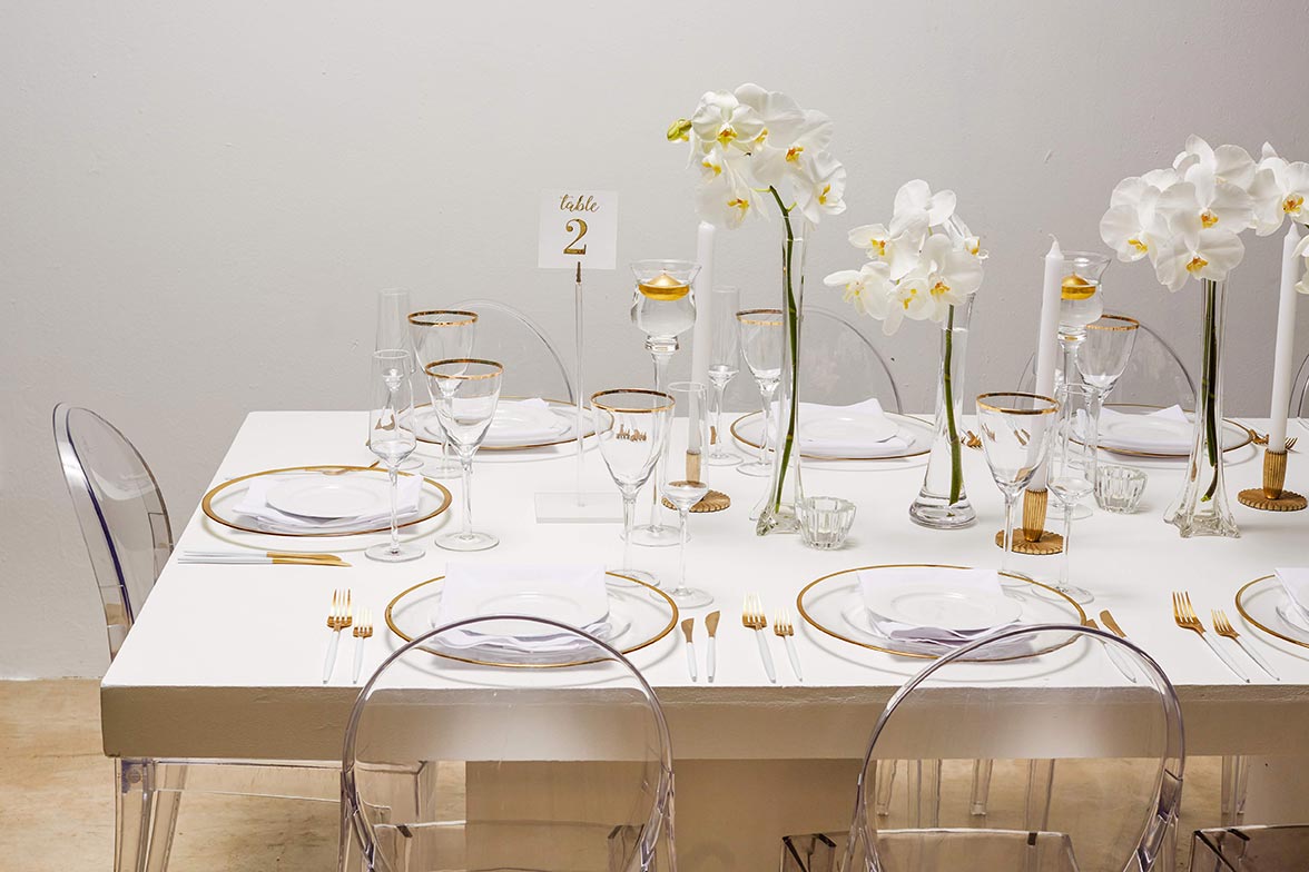 Stylishly arranged table with white decor and floral accents