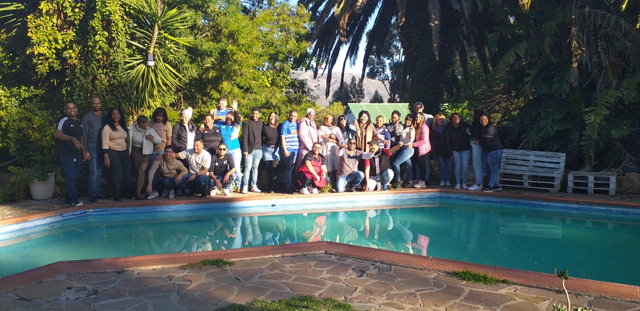 Group photo by the pool at Love Nature venue