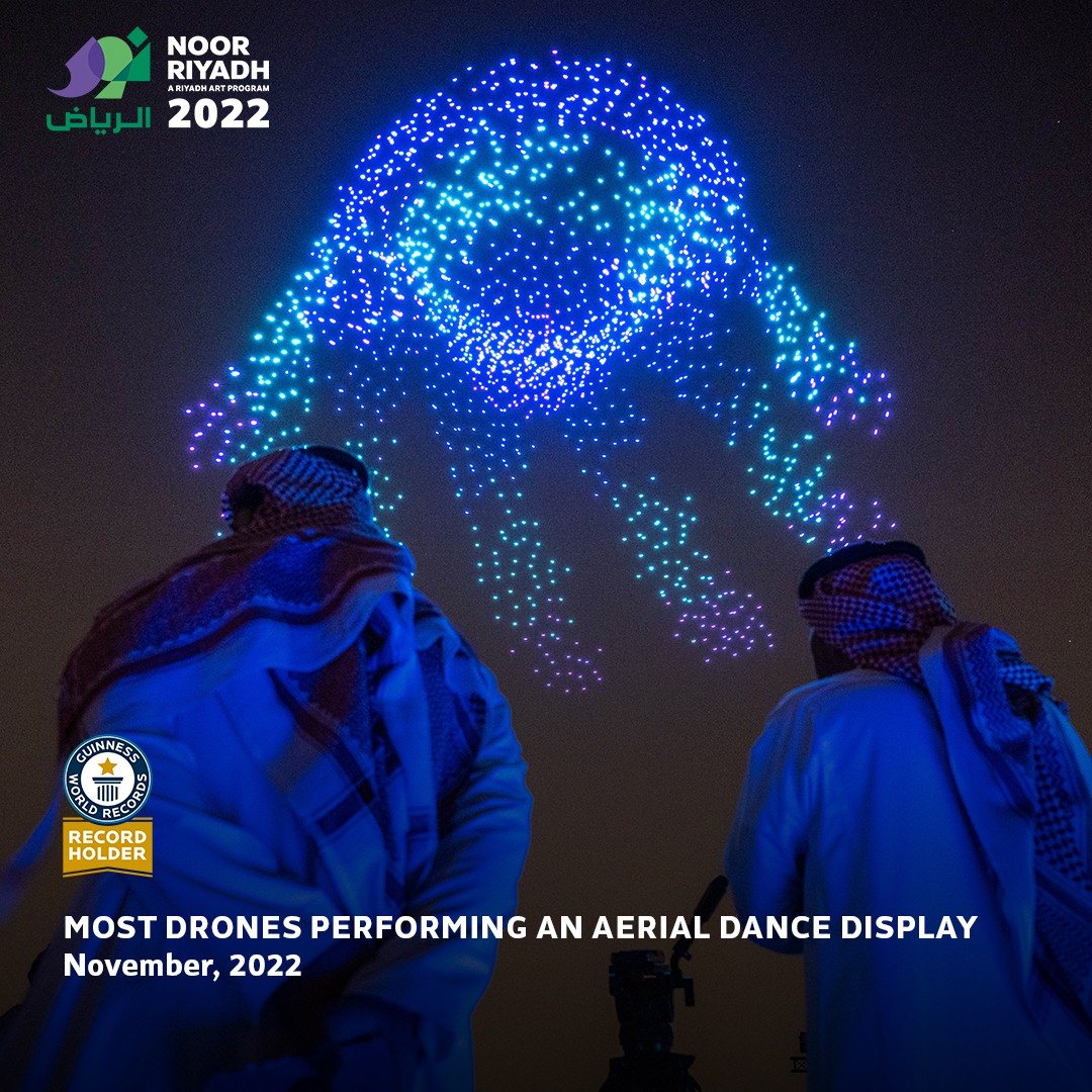 Drone light display showcasing vibrant colors in the night sky.
