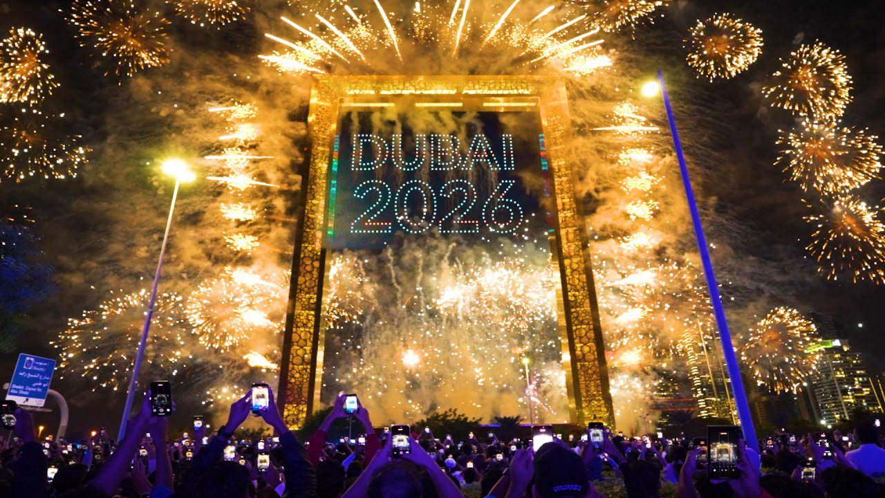 Aerial drone show illuminated with fireworks and displays