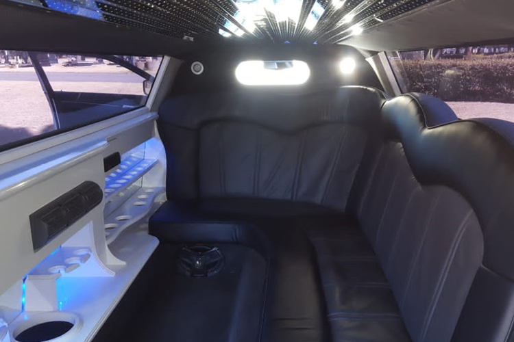 Interior view of a Chrysler 300 C Limousine with leather seats and ambient lighting