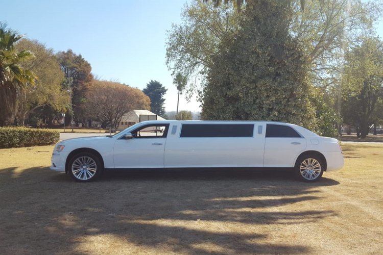 Side view of a white Chrysler 300 C Limousine