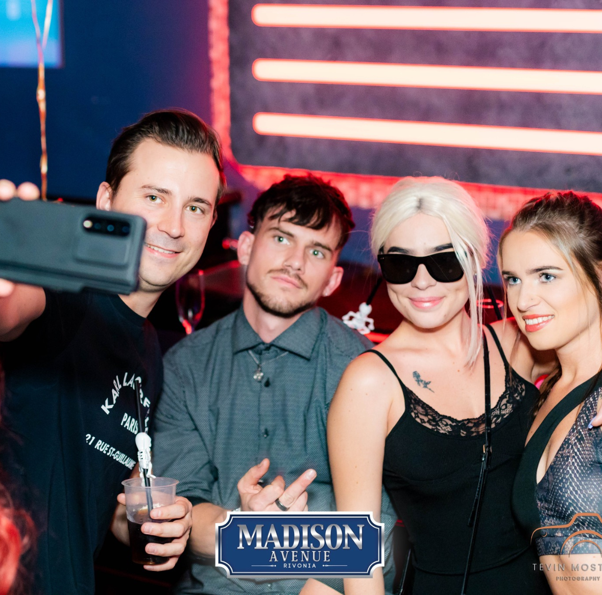 Group of friends taking a selfie at a nightclub