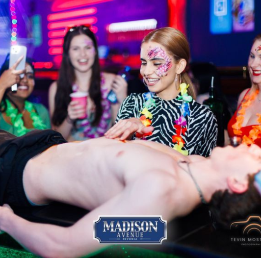 Group enjoying party atmosphere at Madison Avenue Rivonia