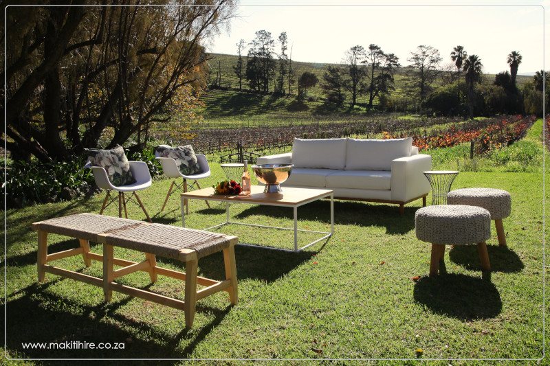 Stylish outdoor lounge setup with seating and decor