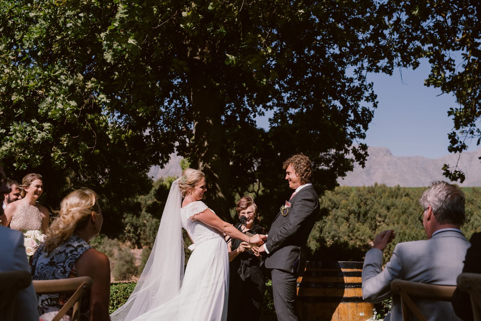 Couple exchanging vows during an outdoor wedding ceremony
