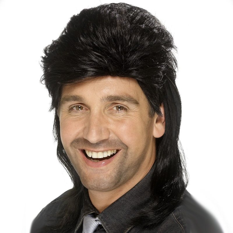 Man wearing a black retro wig smiling at the camera