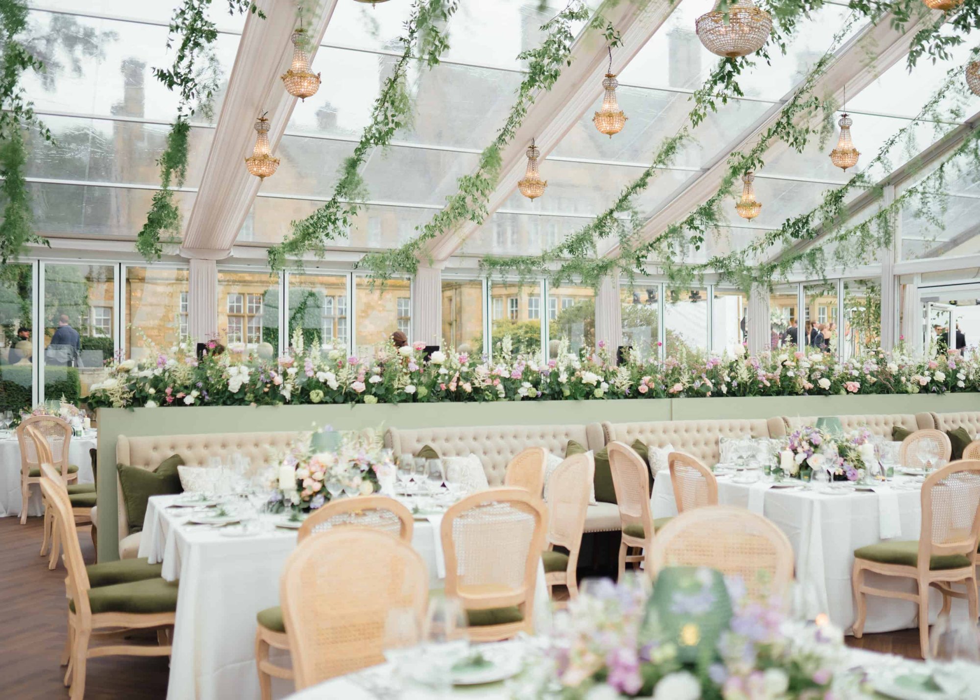 Elegant wedding reception with floral decorations and set tables
