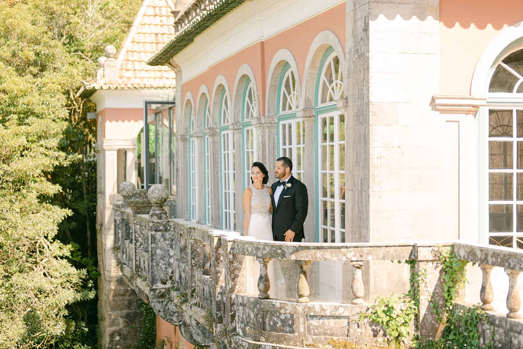Couple standing on a balcony of a luxurious venue