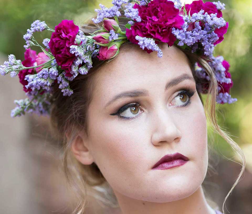 Model with floral crown and bridal makeup