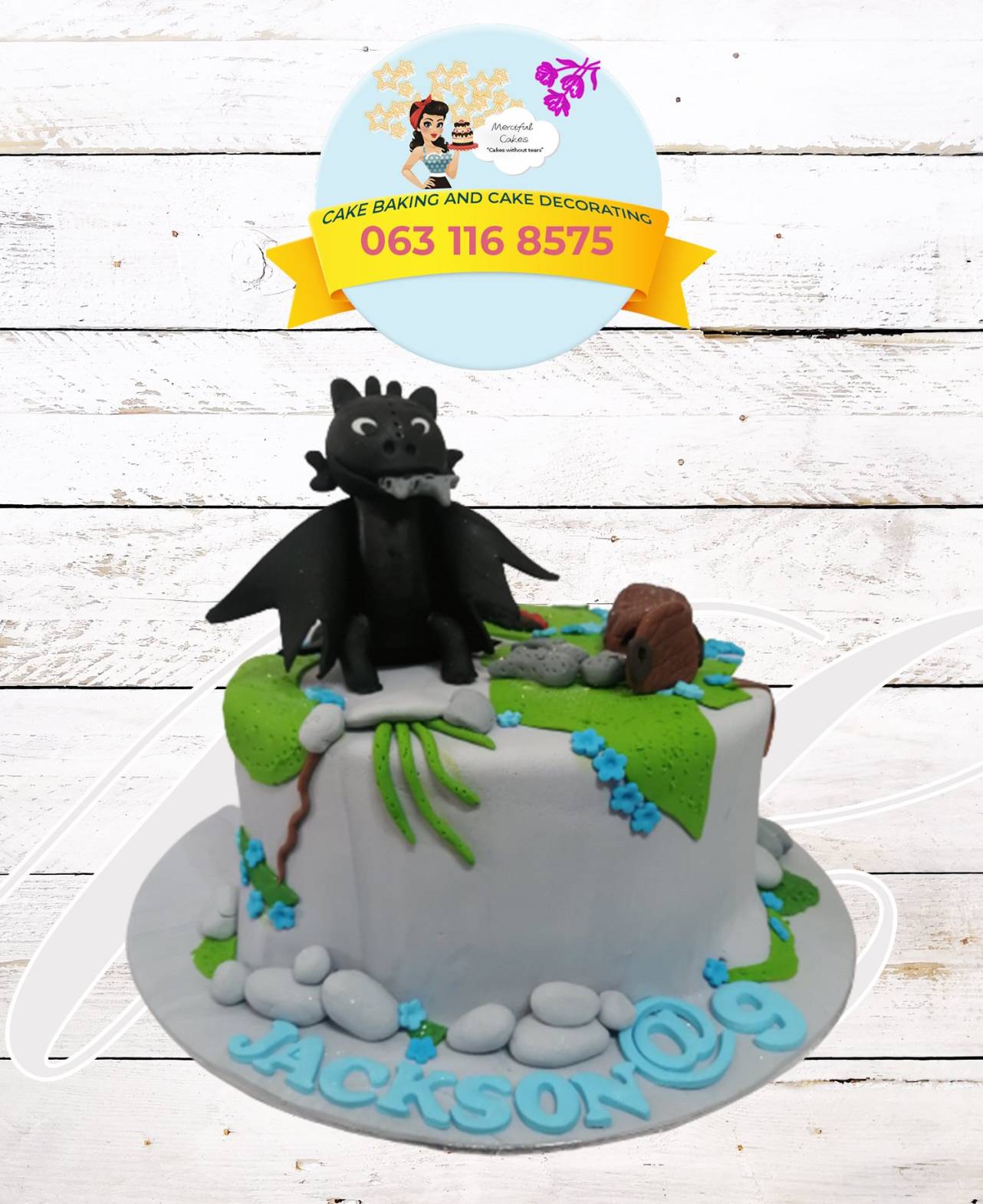 Colorful birthday cake with dragon and hedgehog decorations