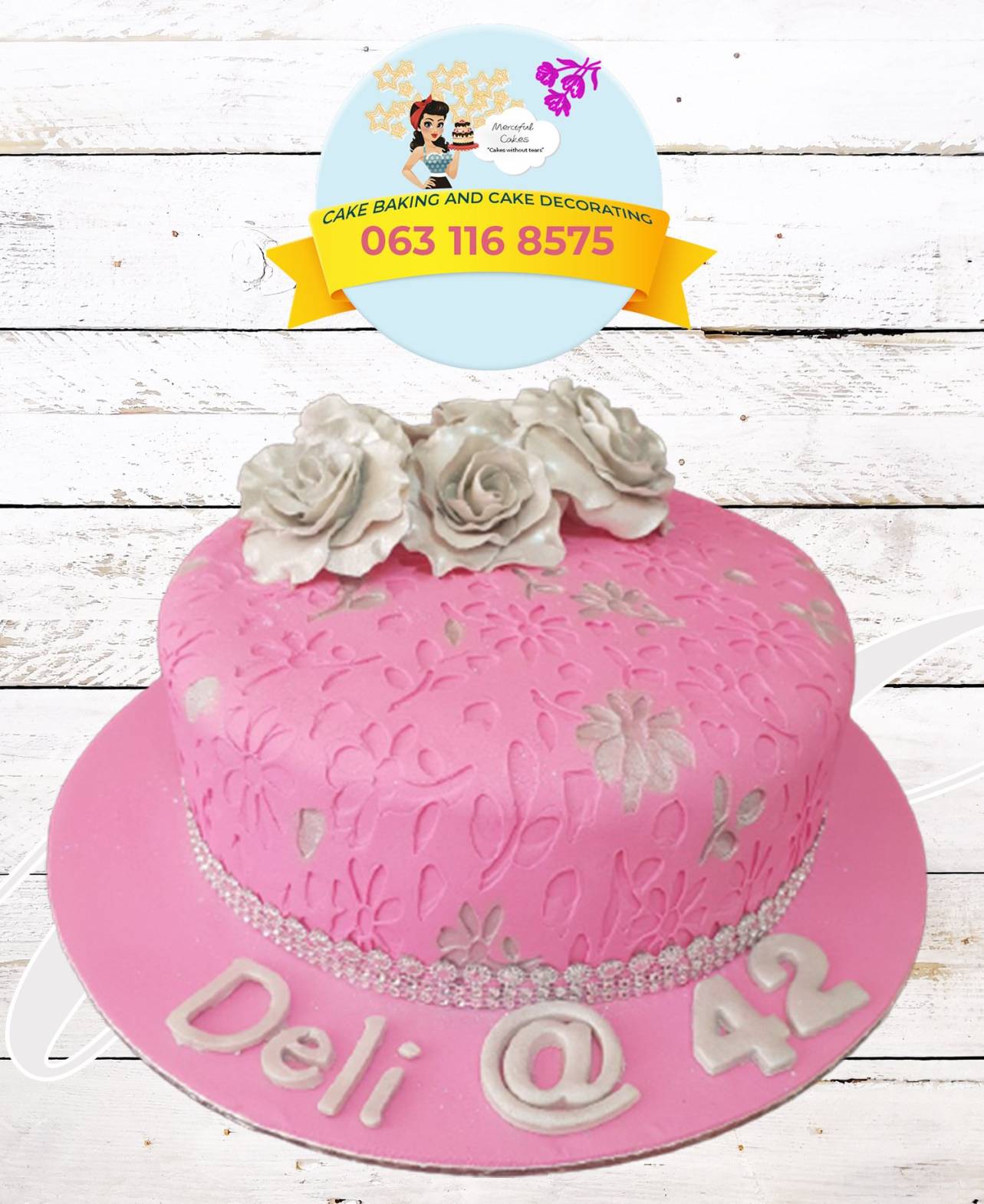 Pink birthday cake with flowers and custom inscription