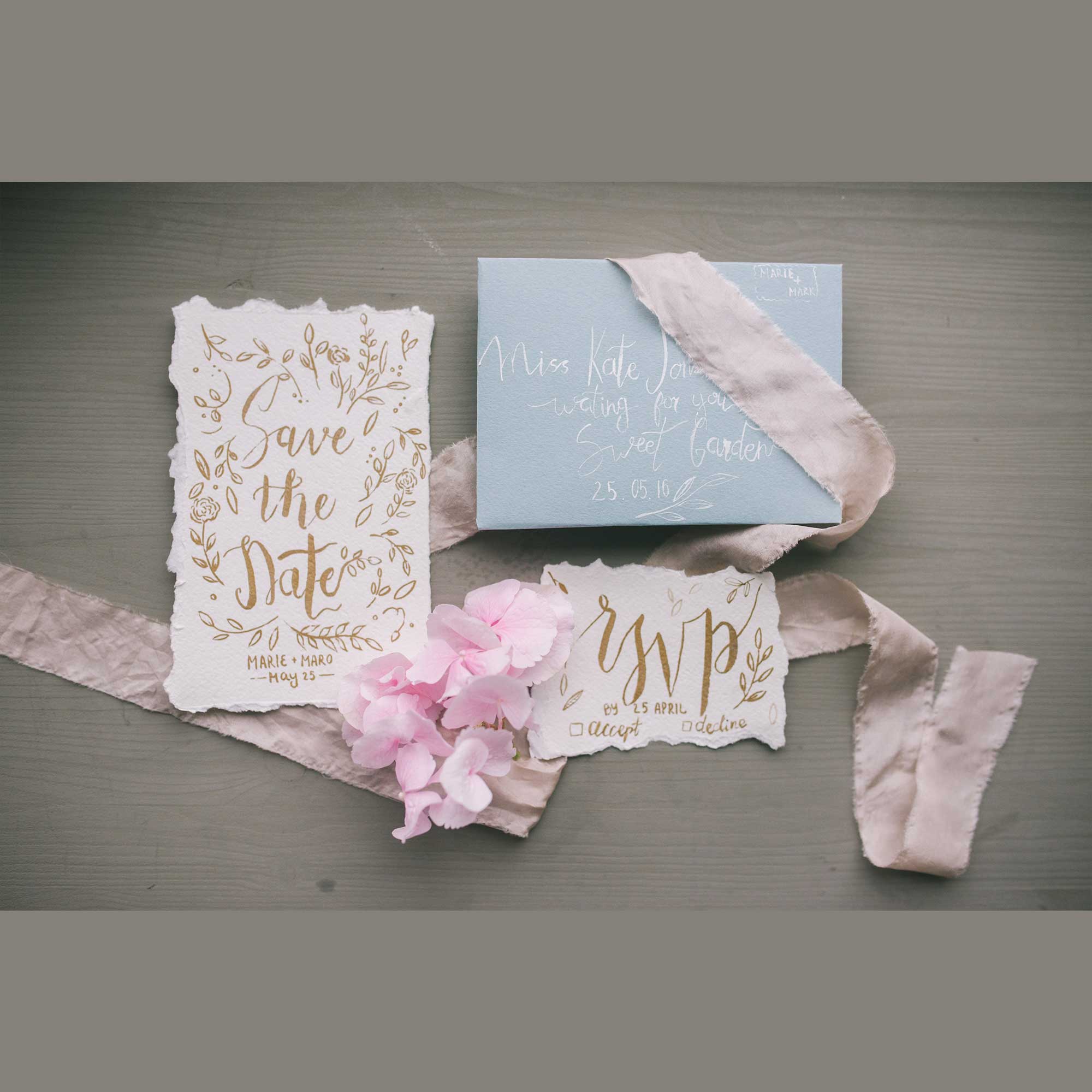 Artfully designed save the date and RSVP invitations with floral motifs.