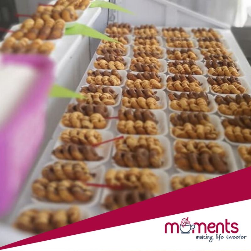 Display of assorted dessert treats in trays.