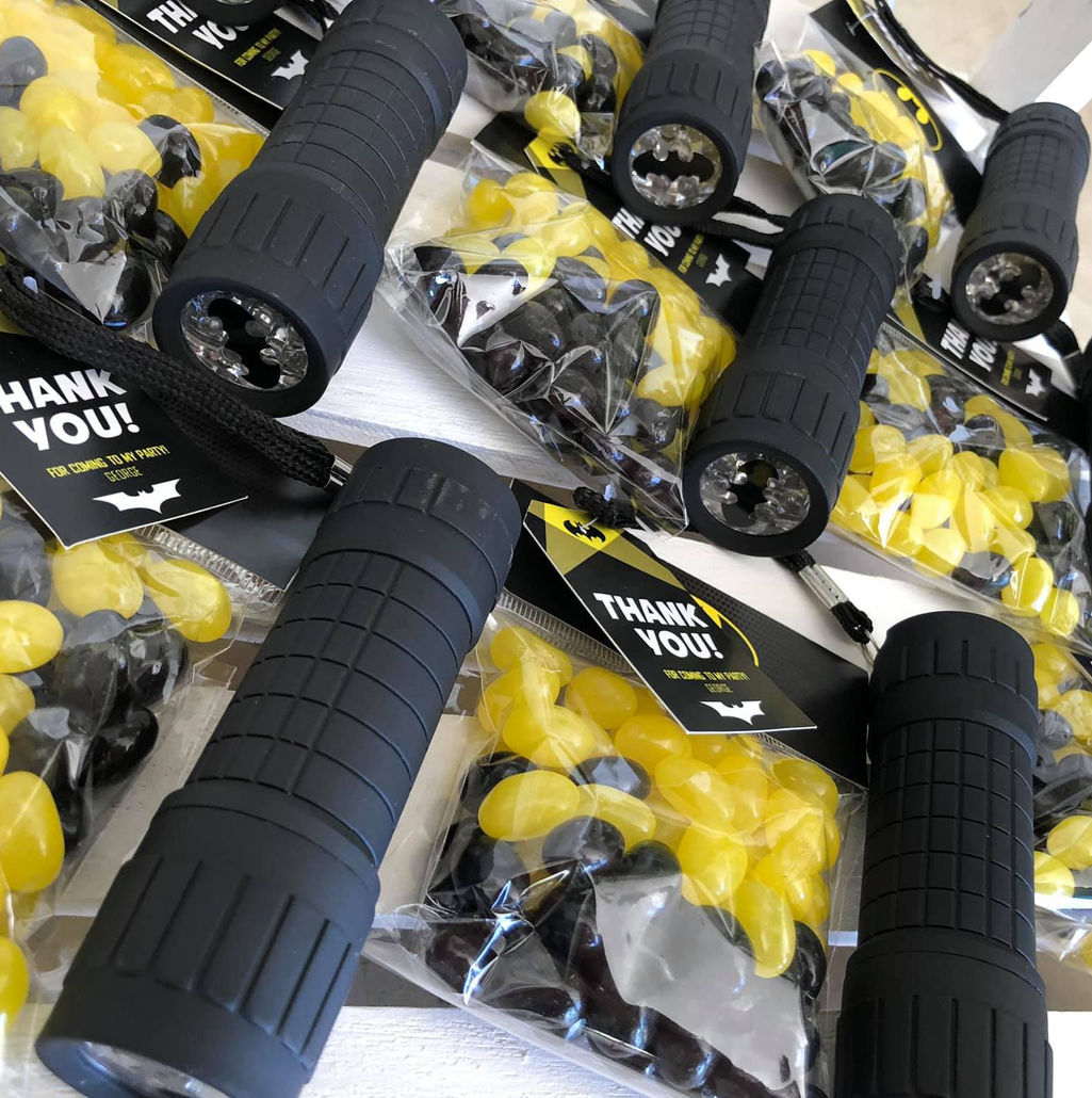 Party favour packs with mini flashlights and candy