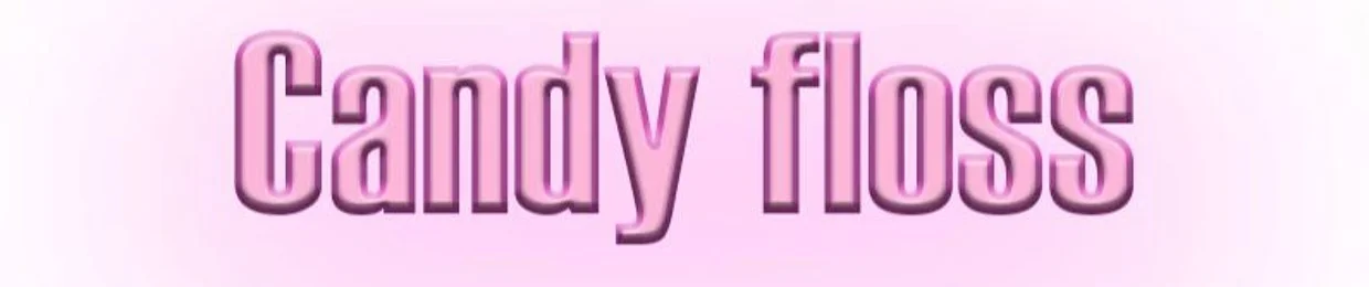 Candy floss station signage in pink text