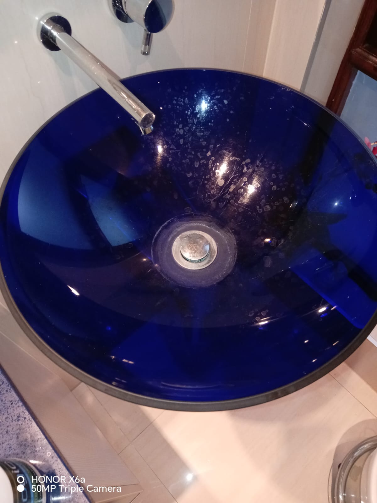 Blue decorative wash basin with chrome faucet