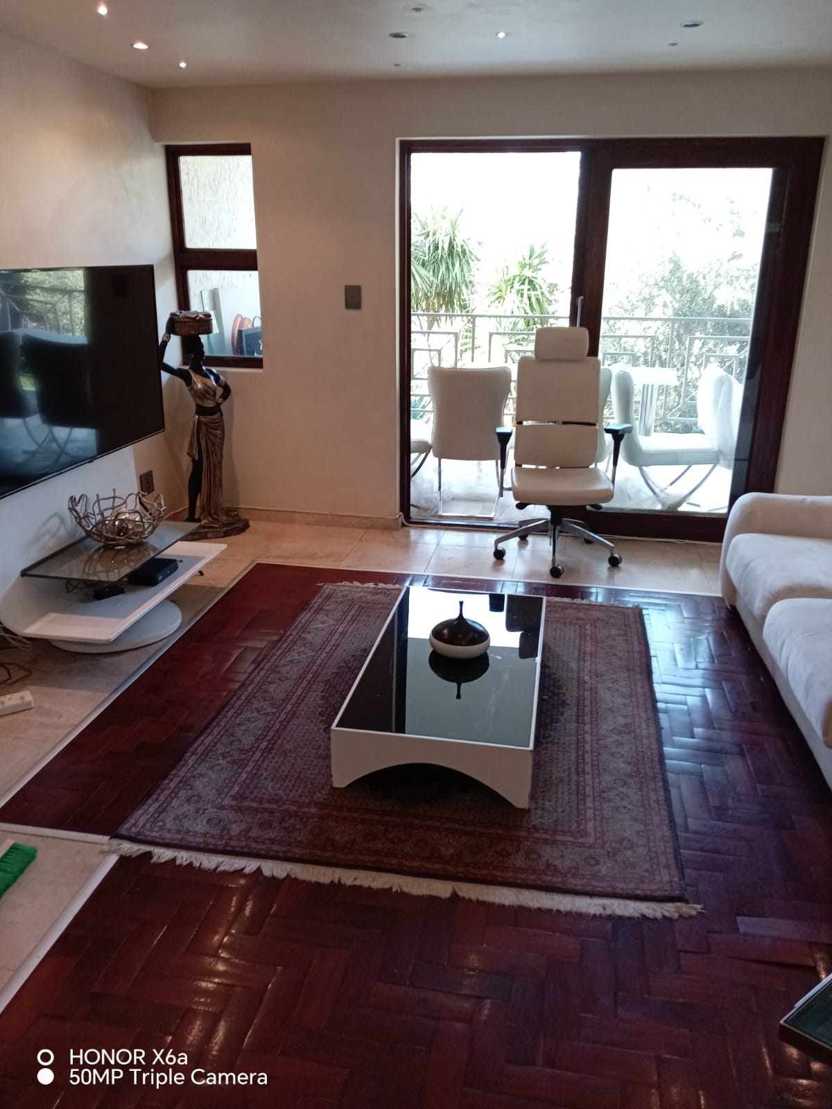 Modern office lounge with stylish furniture and natural light.