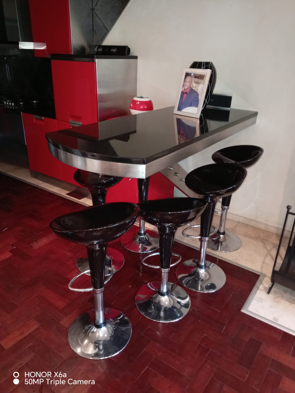 Black bar with stools and a photo frame