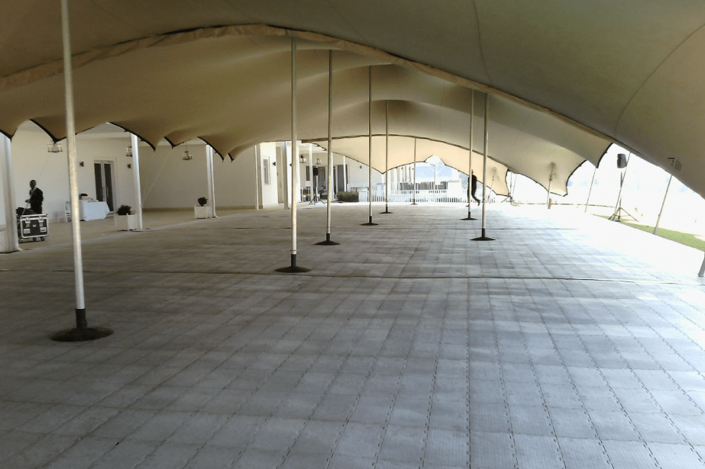 Large stretch tent installation with flooring ready for an event
