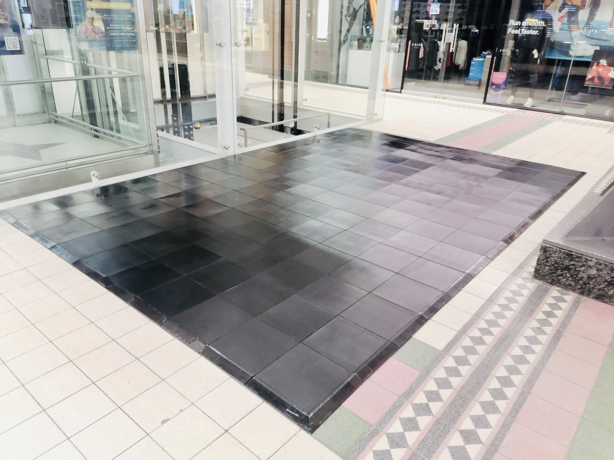 Installed black dance floor in a venue setting