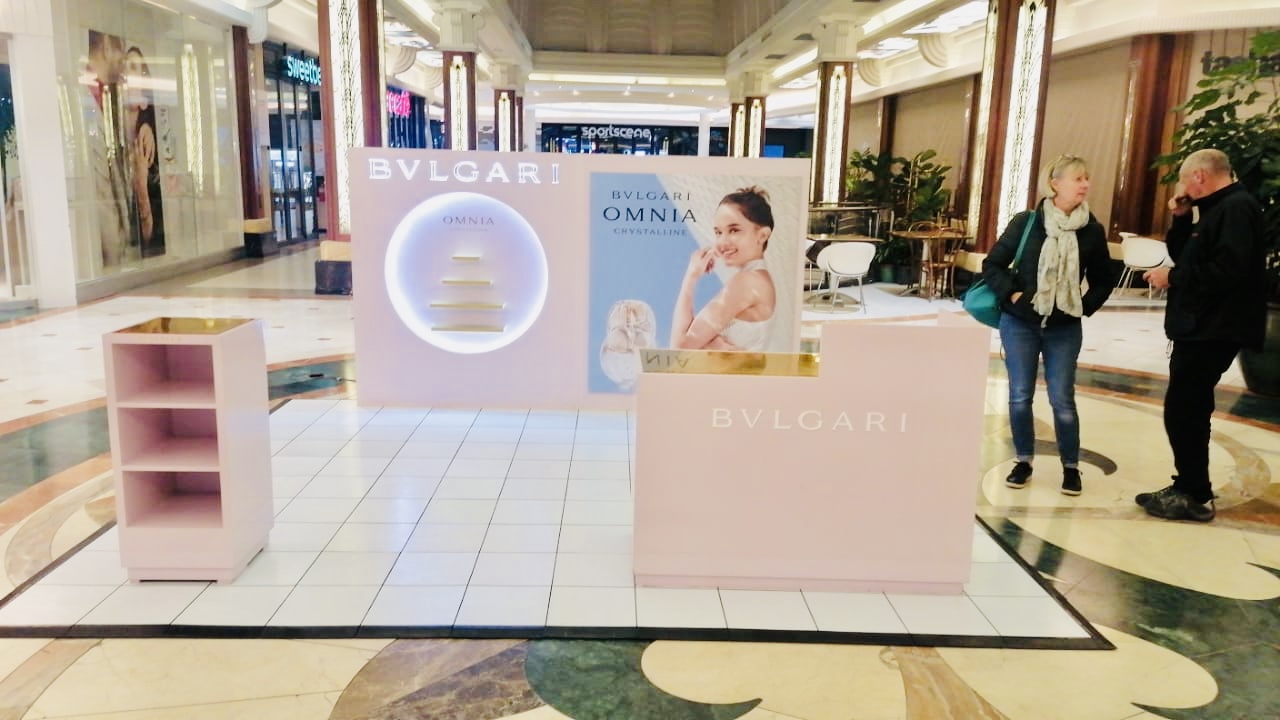 Modern exhibition stand with branding and displays