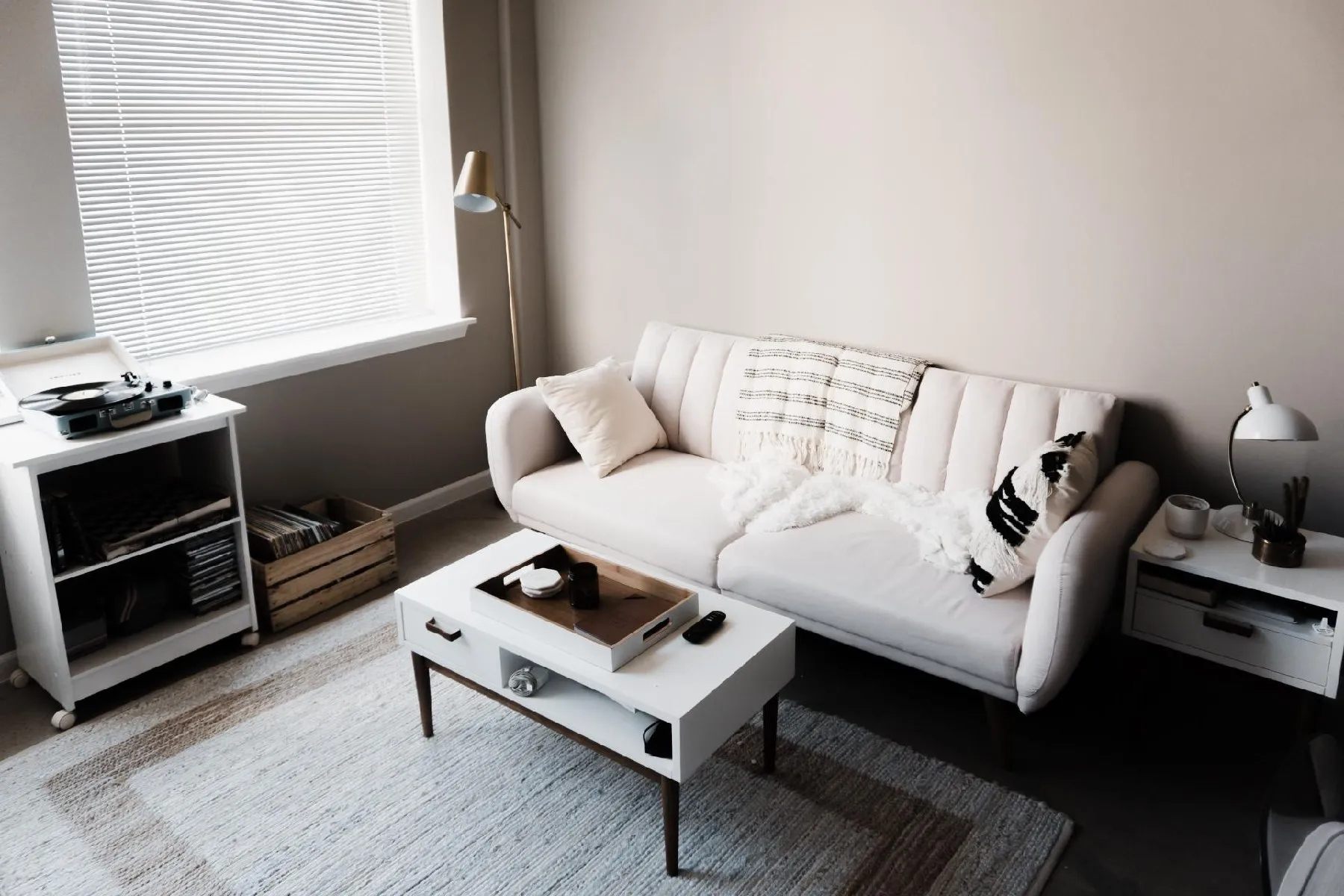 A cozy living room setup with a stylish couch and coffee table.