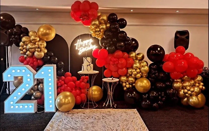 Balloon decor installation for a 21st birthday celebration.