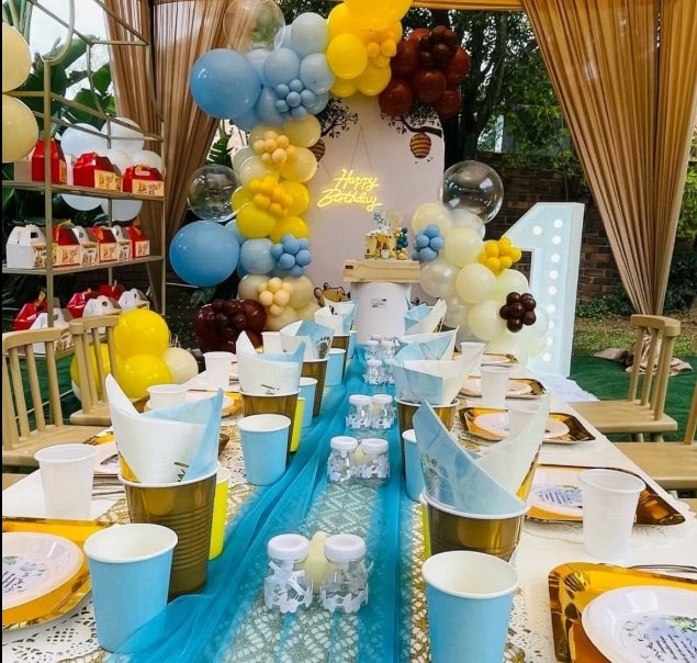 Birthday table decorated with balloons and tableware
