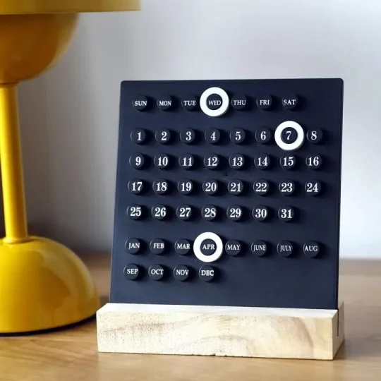 Stylish black desk calendar with wooden base
