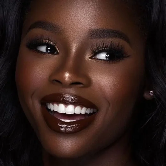 Close-up of a bride smiling with elegant makeup
