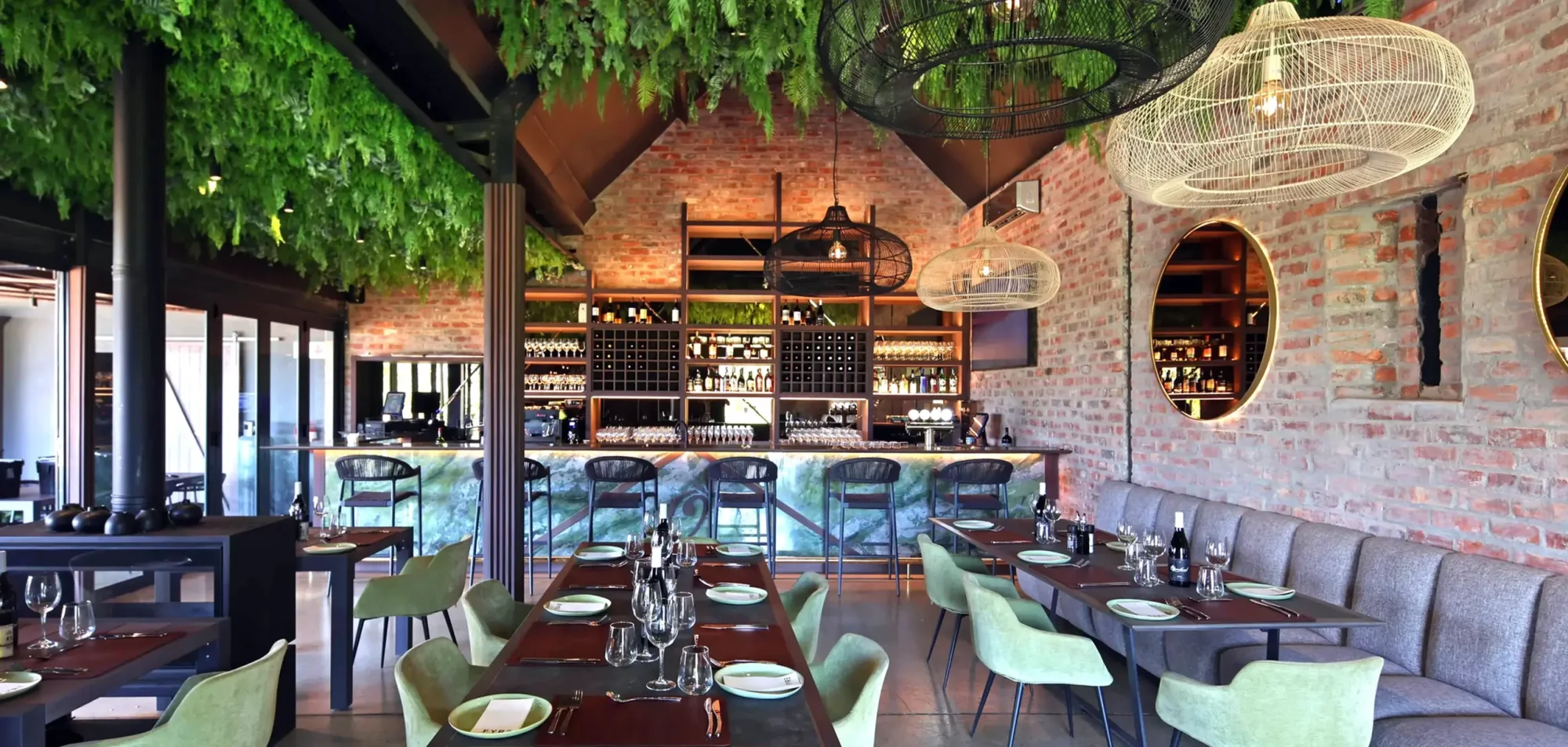 Interior view of the restaurant with green decor and seating