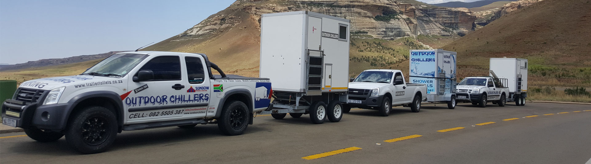 Line of Outdoor Chillers delivery vehicles on a road.