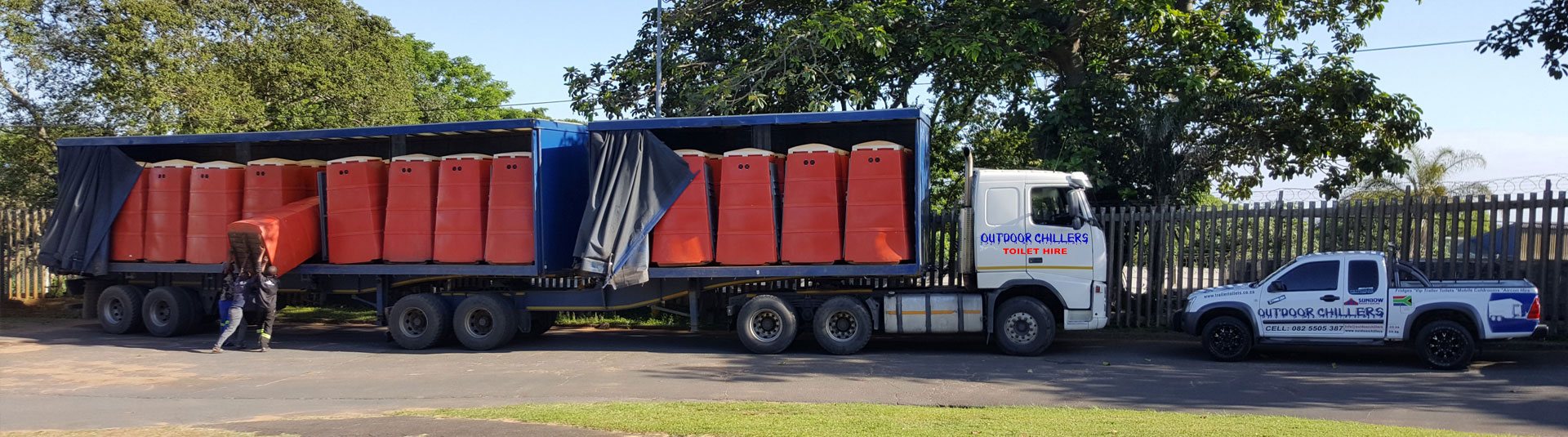Truck with mobile cold rooms being unloaded