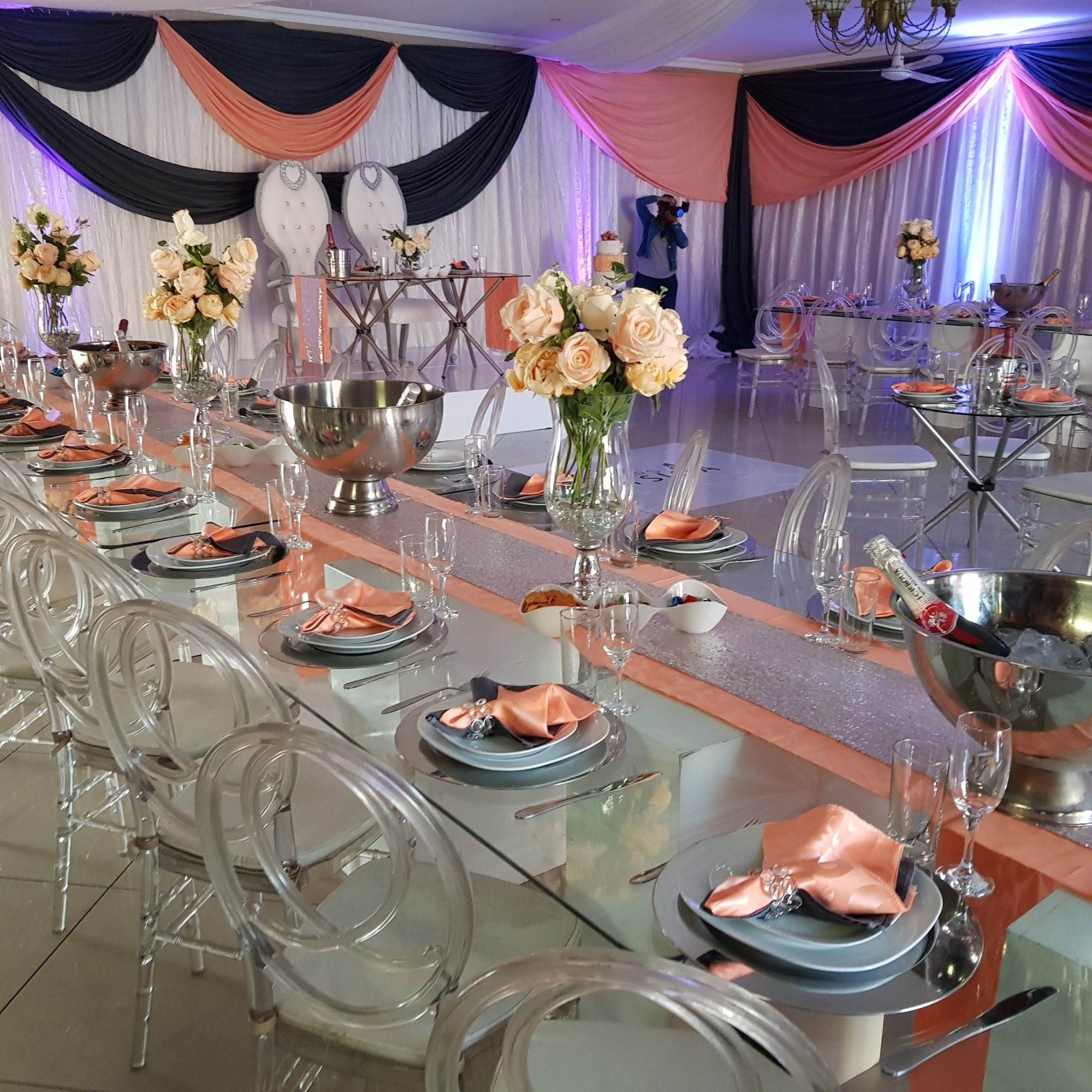 Beautifully arranged dining table with floral centerpieces and elegant decor.