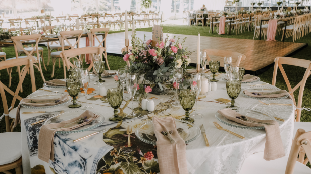 Stylish table setting with floral centerpiece and elegant dinnerware.