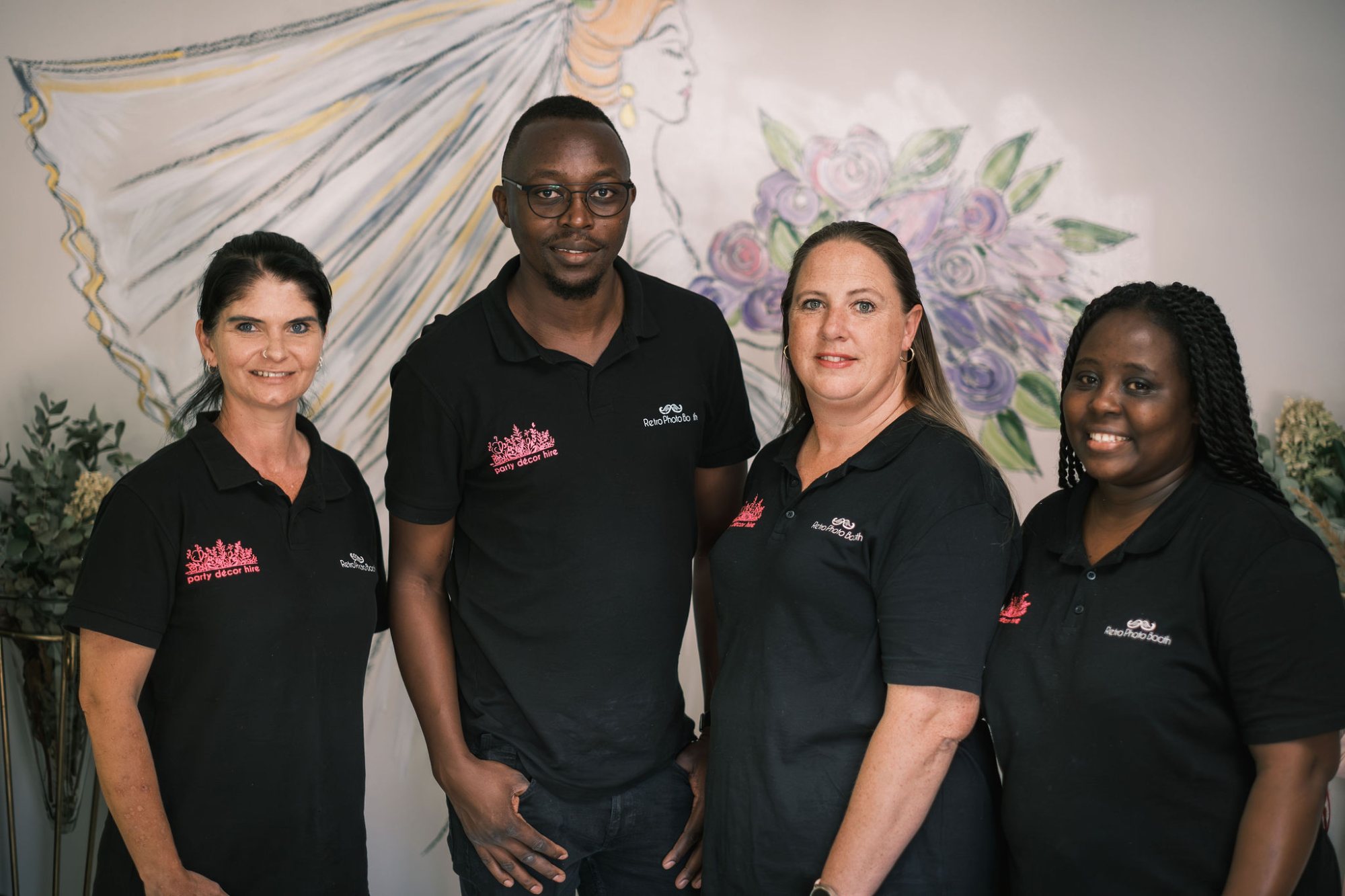 Four team members from Party Decor Hire posing together