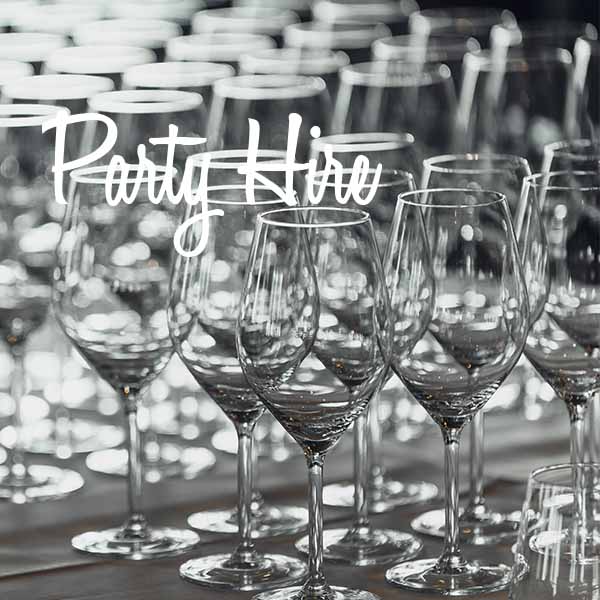 Row of clear wine glasses set on a table