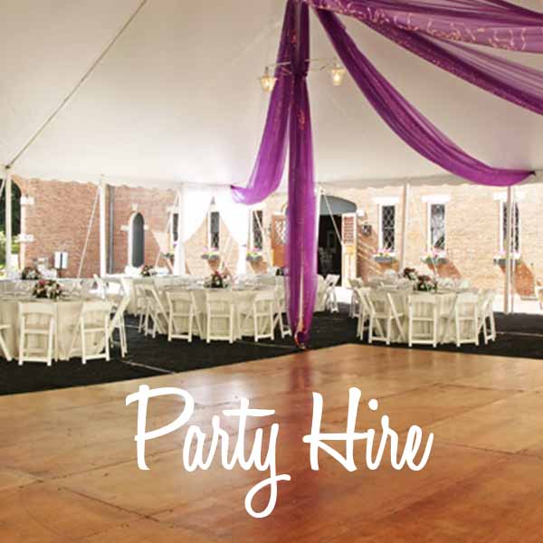 Inside view of a marquee with draping and seating arrangement