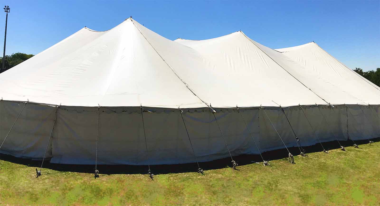 Large stretch tent set up on grass